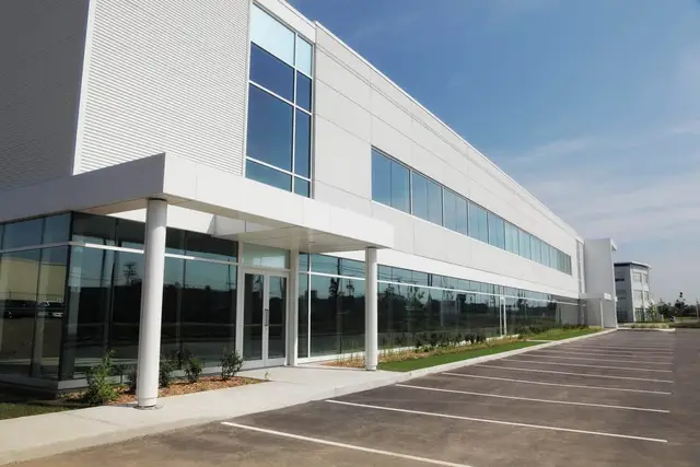 Renovated white commercial building after facade services
