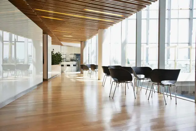 Modern office lobby with patterned carpet and curved seating