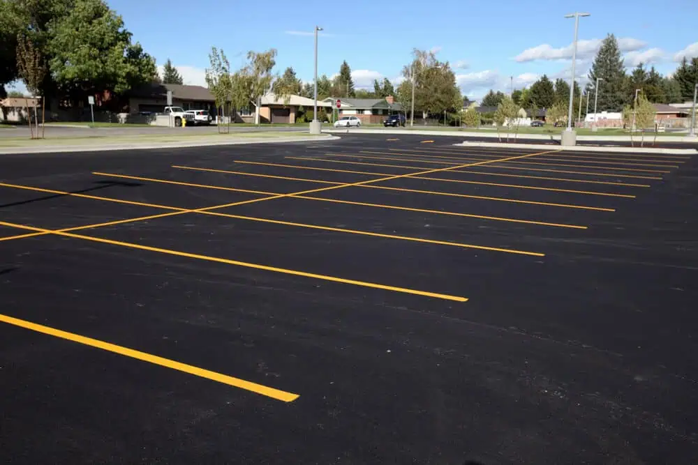 Freshly sealed parking lot with new striping