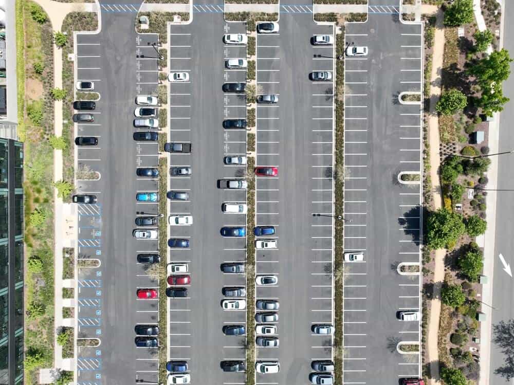 Overhead view of a parking lot with space striping and handicapped spots