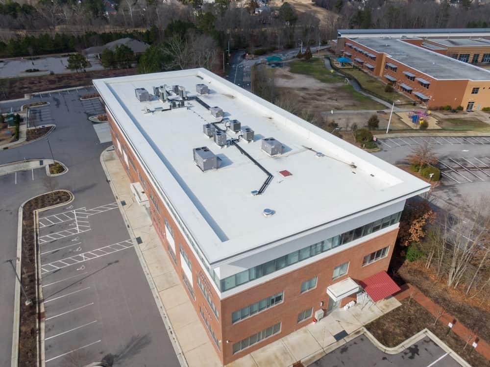 white roofing membrane installed on a brick school building