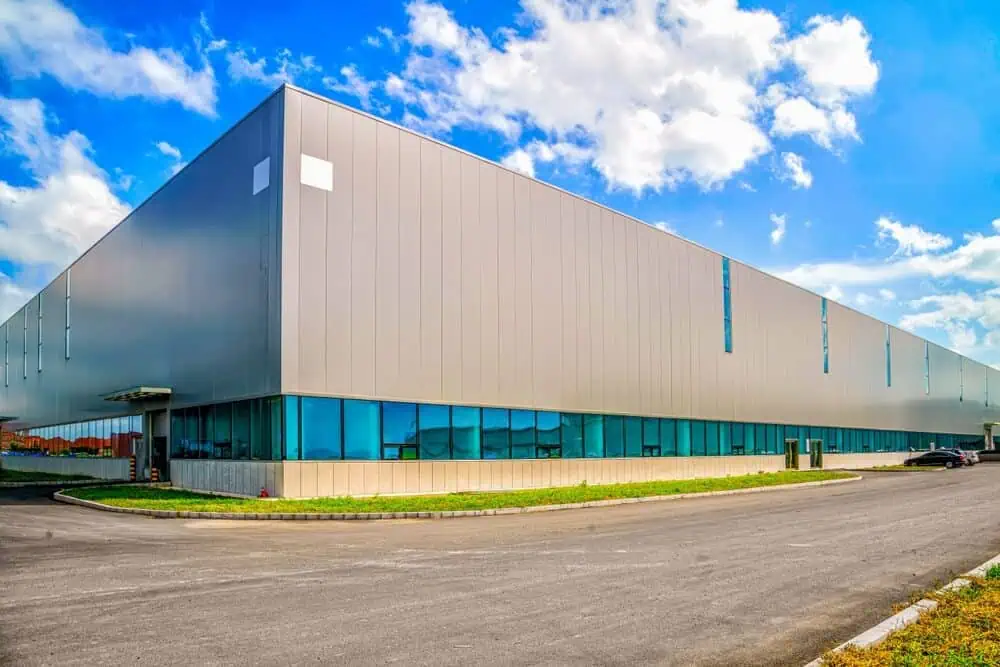 A large commercial building with tall metal siding panels.