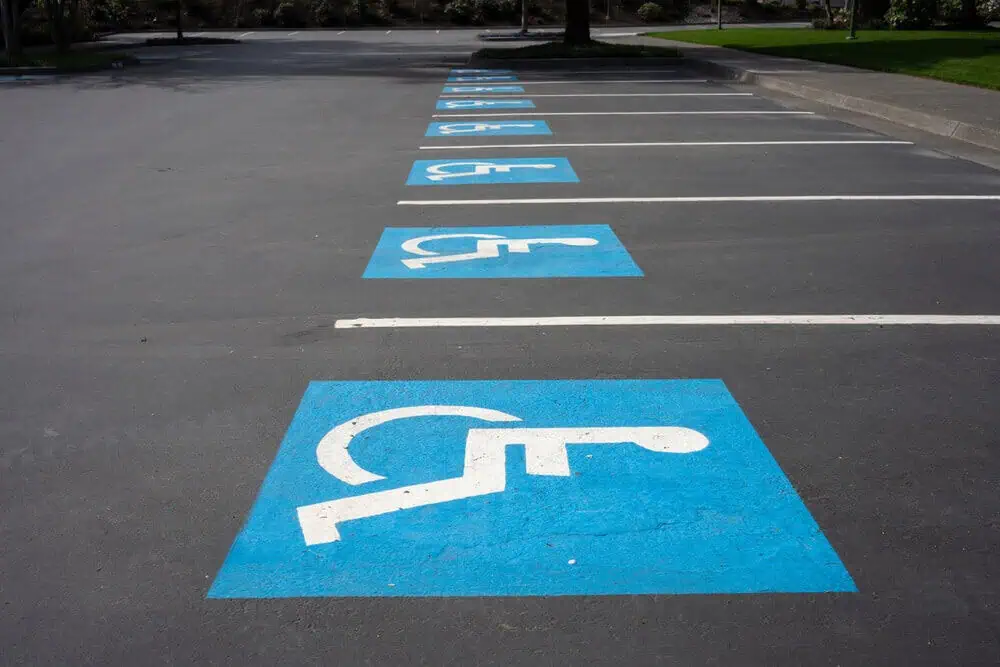 A row of ADA-compliant parking spaces in a parking lot