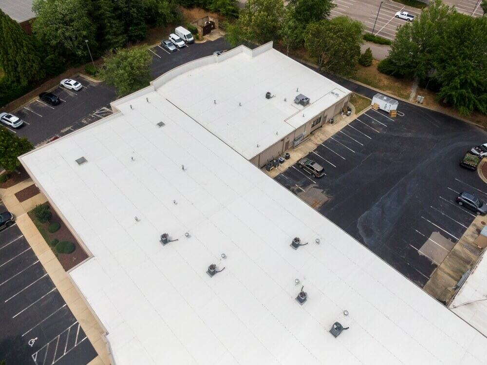 A large commercial facility protected by a reflective TPO roofing system
